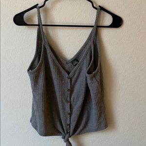 Cropped gray tank top.